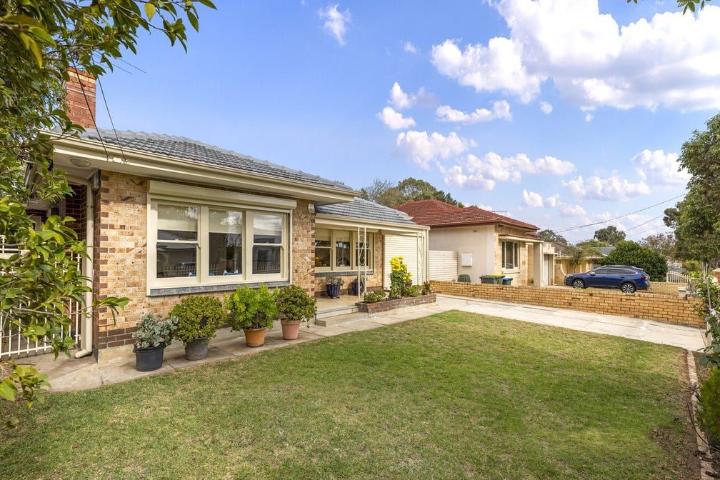 The front of the Colton Avenue home in Magill, a single-storey brick house set back behind a lawn